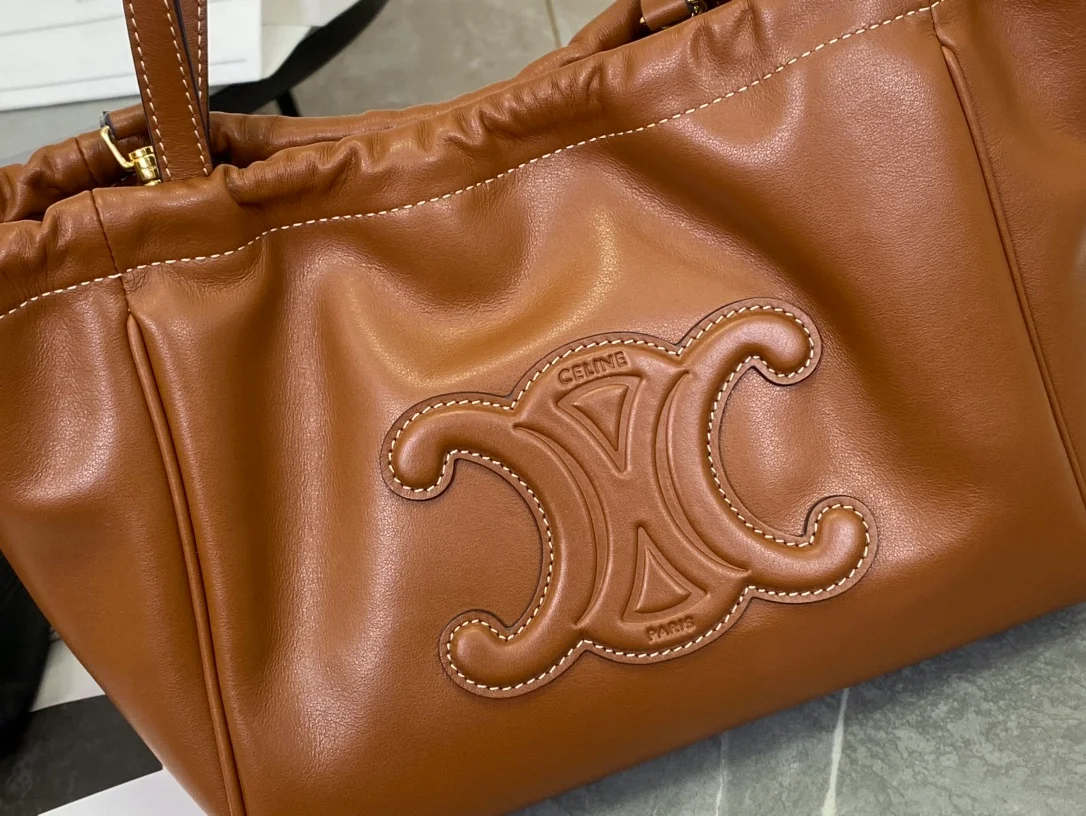 퀴르 트리옹프 스몰 드로우스트링 카바스 상세