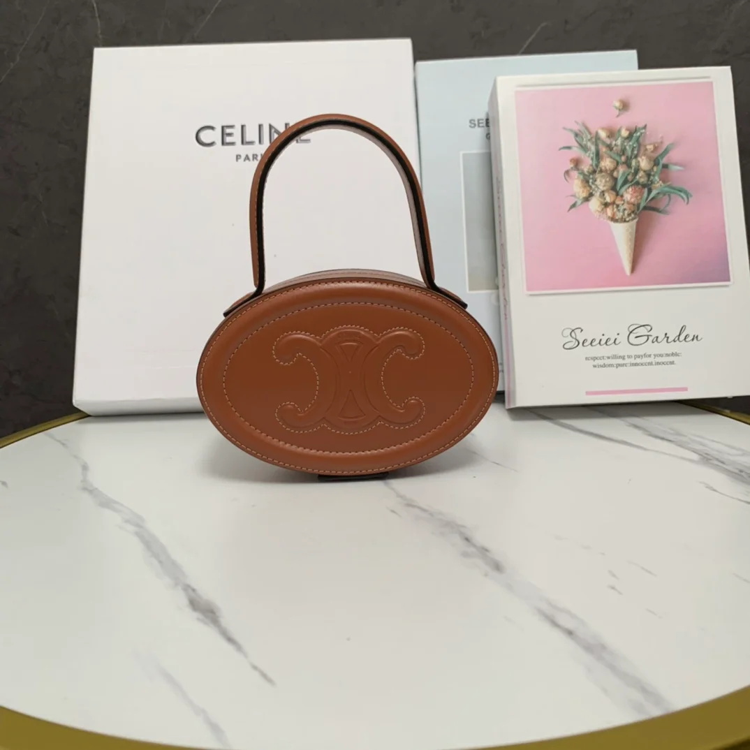 트리옹프 오벌 미노디에르 토트백 탠 상세